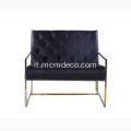 Lounge chair in pelle trapuntata con struttura sottile